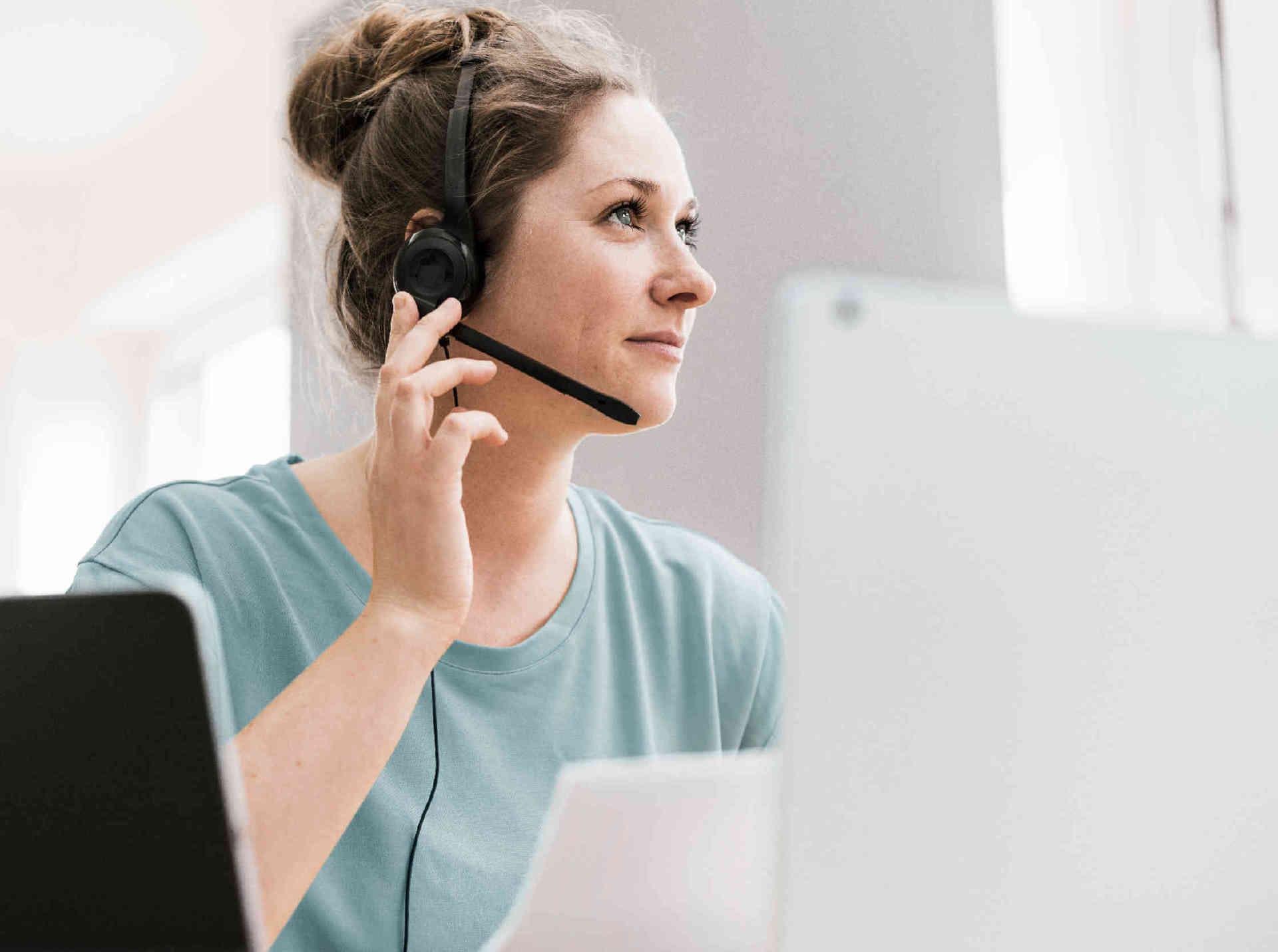 Woman with headset in office