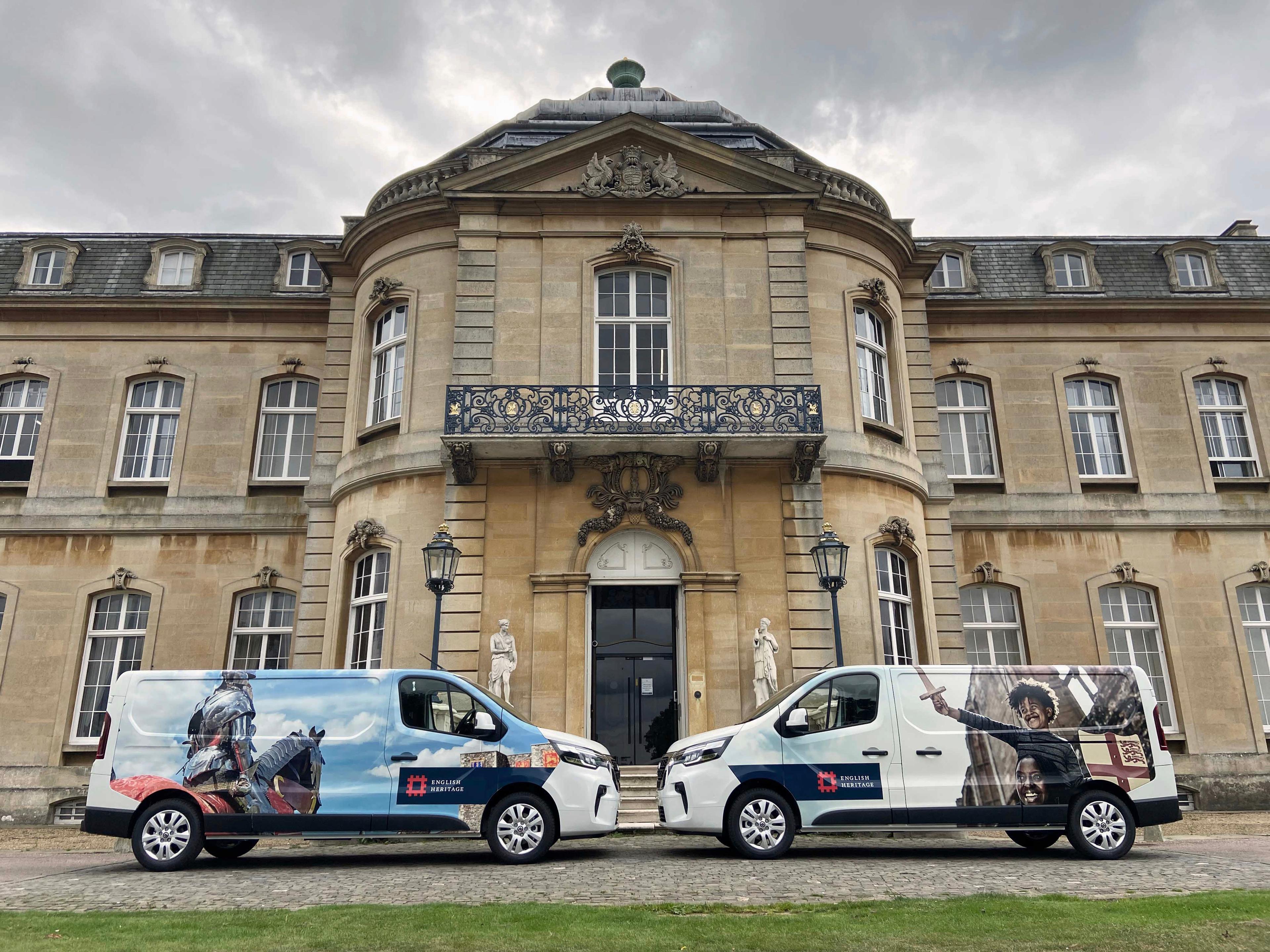 Image of two Nissan Primastar vans with bespoke livery, parked outside the Grade I listed English Heritage property, Wrest Park in Bedfordshire