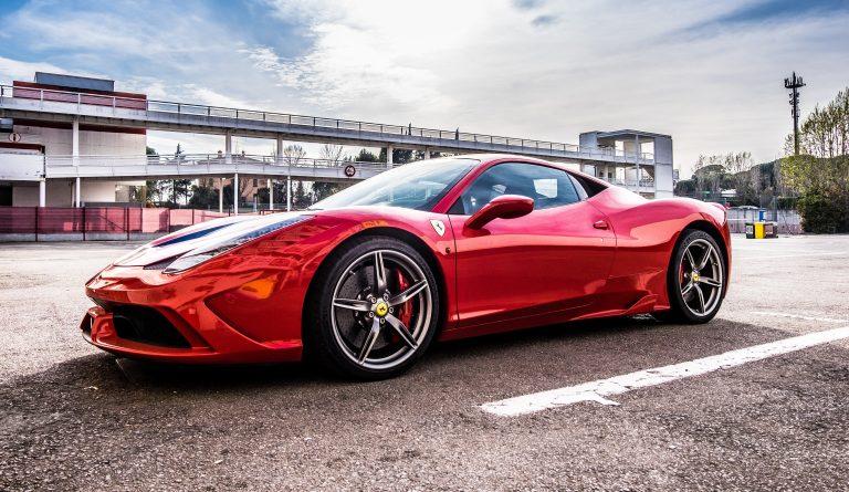 Image of a red Ferrari in a car park
