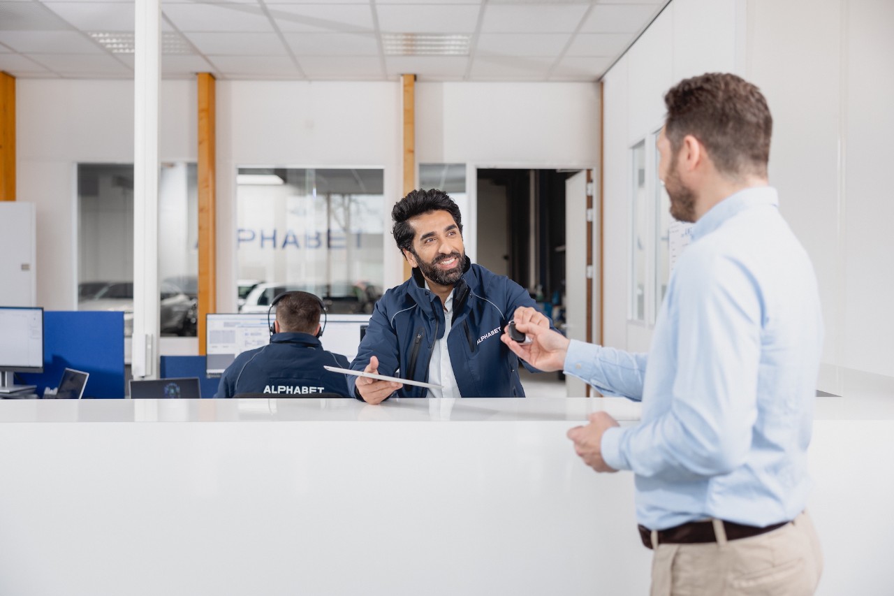 Two people in a meeting at a counter
