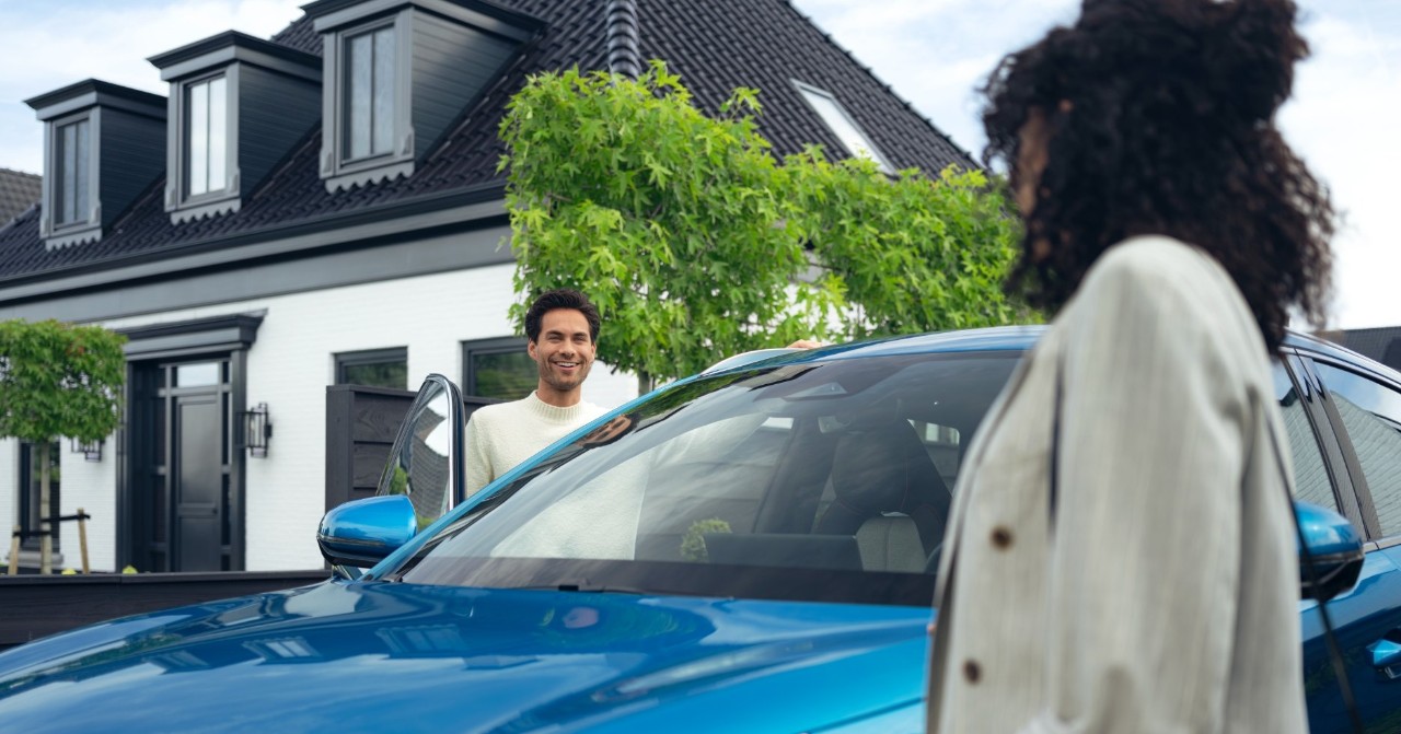 Man smiles at person in the foreground who is slightly out of shot.