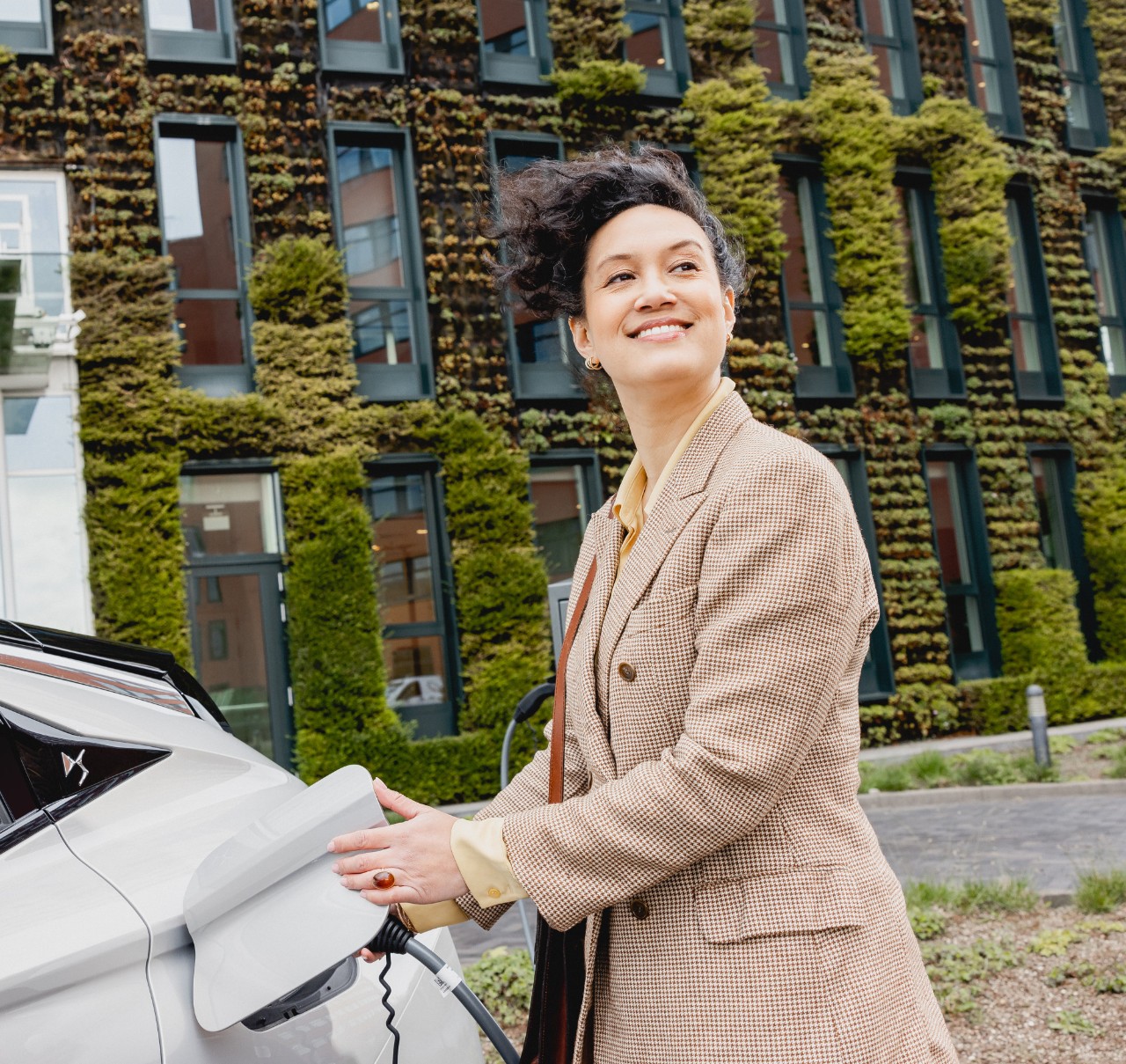 woman recharging car